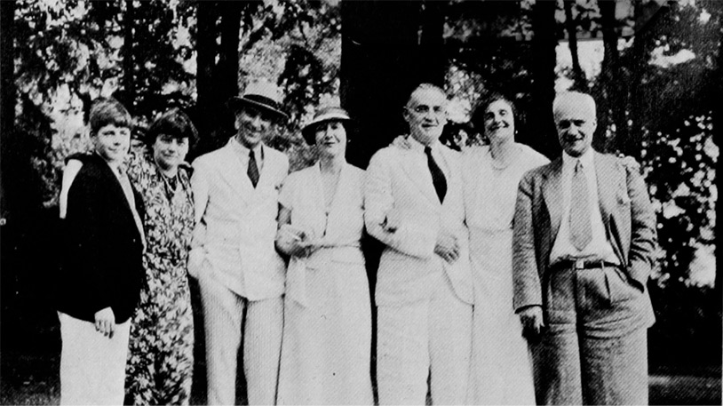 Caption: James K. Cogswell on the first platform paddle tennis court erected on his property