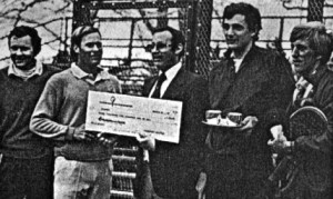 Passport Scotch's Jeff Gollin presents winning check to Steve Baird (left) and Rich Maier. Runners-up were Herb Fitz Gibbon and Hank Irvine