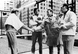 Robert E. Schott, vice president, Uniroyal, Inc., Consumer Products Division, left, presents $10,000 prize money to Hank Irvine and Herb Fitz Gibbon, as Dick Squires offers his congratulations.